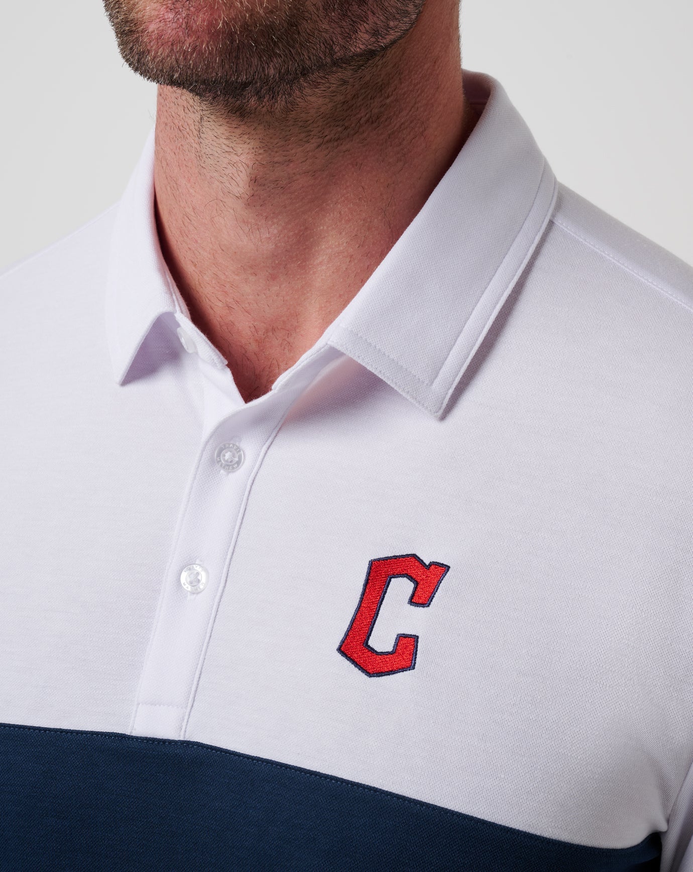 White/Navy Travis Mathew Cleveland Guardians Home Run Leader Polo