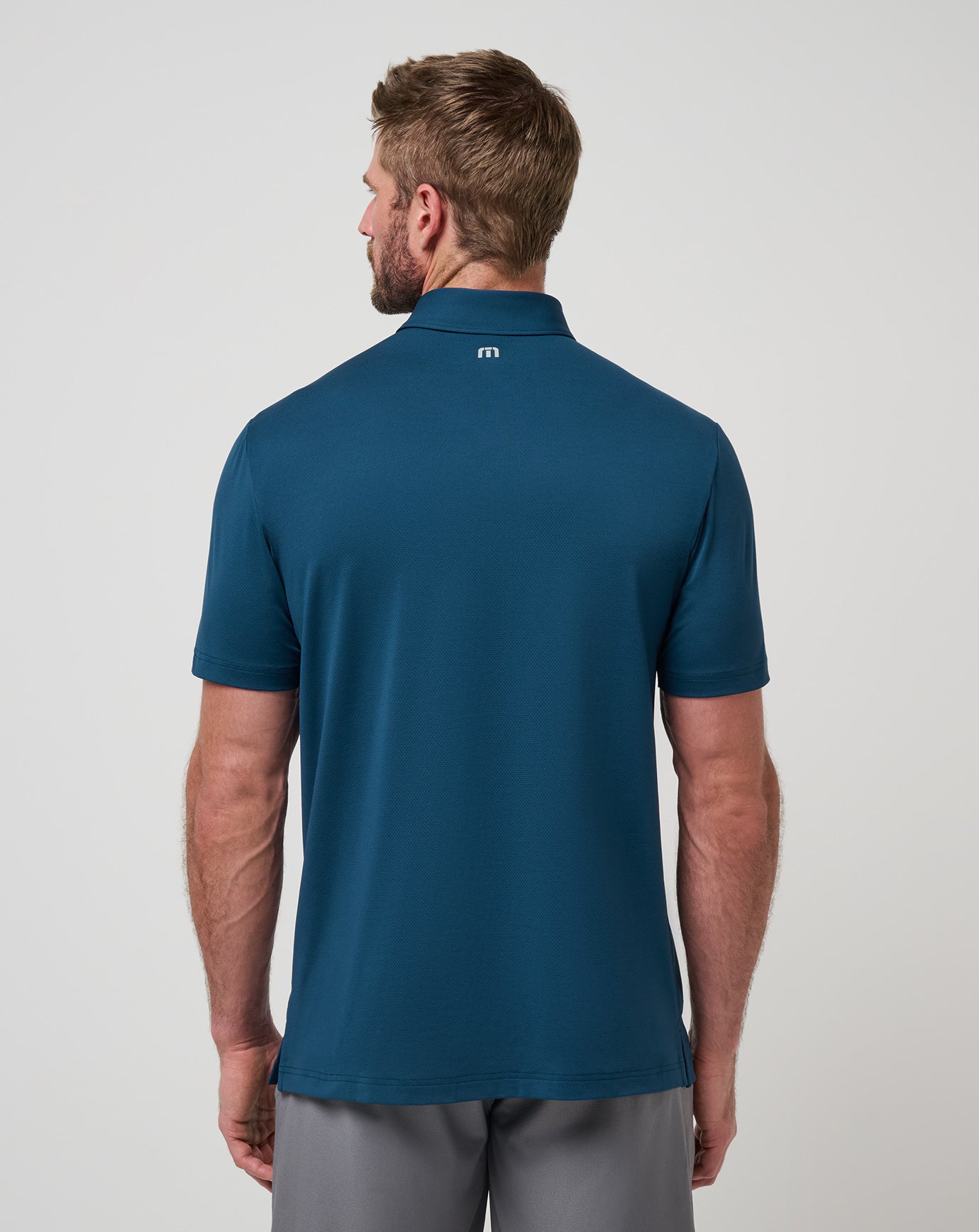 Titan Travis Mathew Heater Pro Chest Stripe Polo