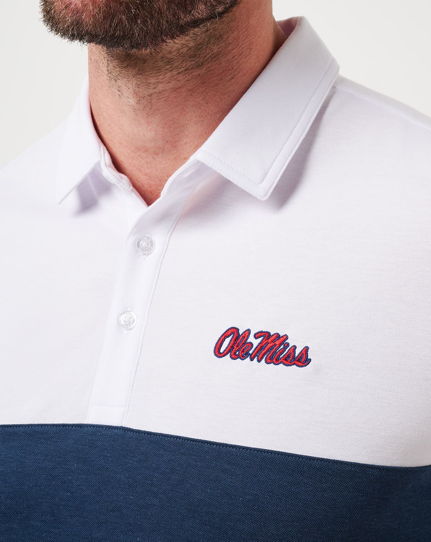 White/Navy Travis Mathew Mississippi Drop Back Polo