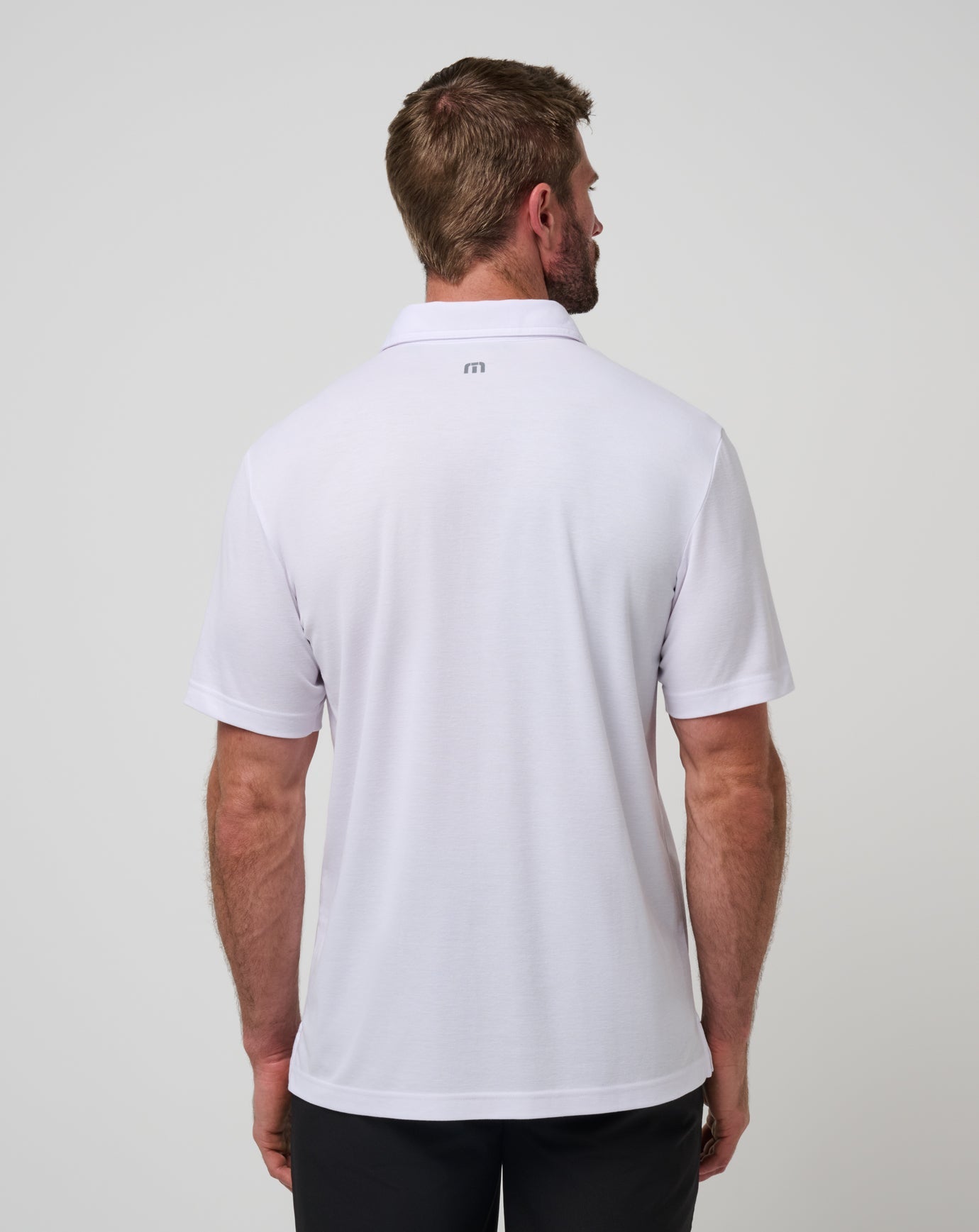 White/Black Travis Mathew Nebraska Top Recruit Polo