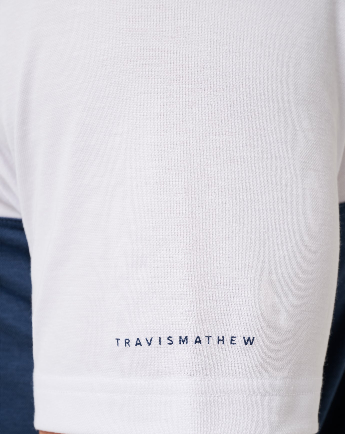 White/Navy Travis Mathew Michigan Drop Back Polo