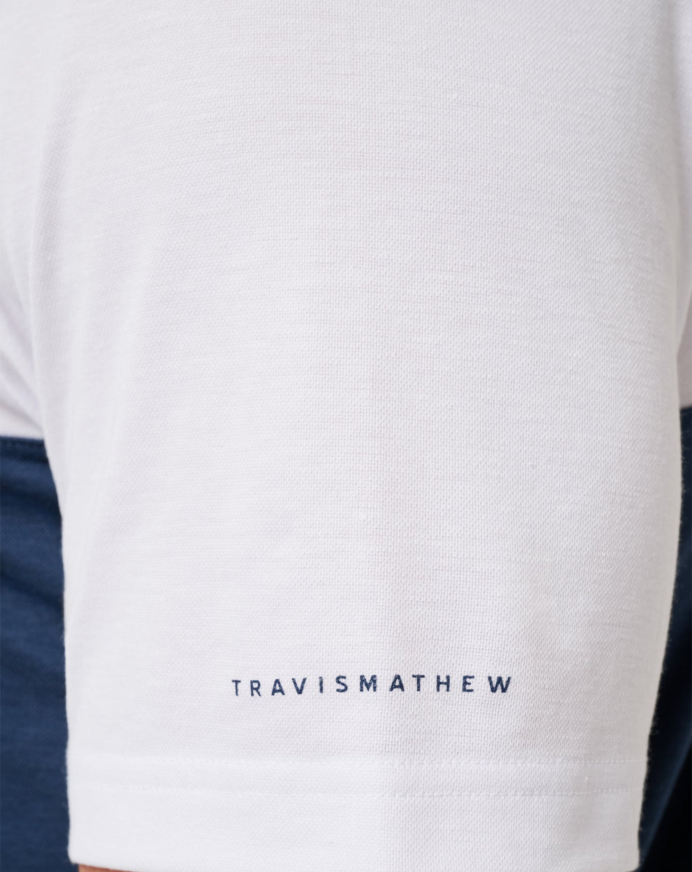 White/Navy Travis Mathew Michigan Drop Back Polo