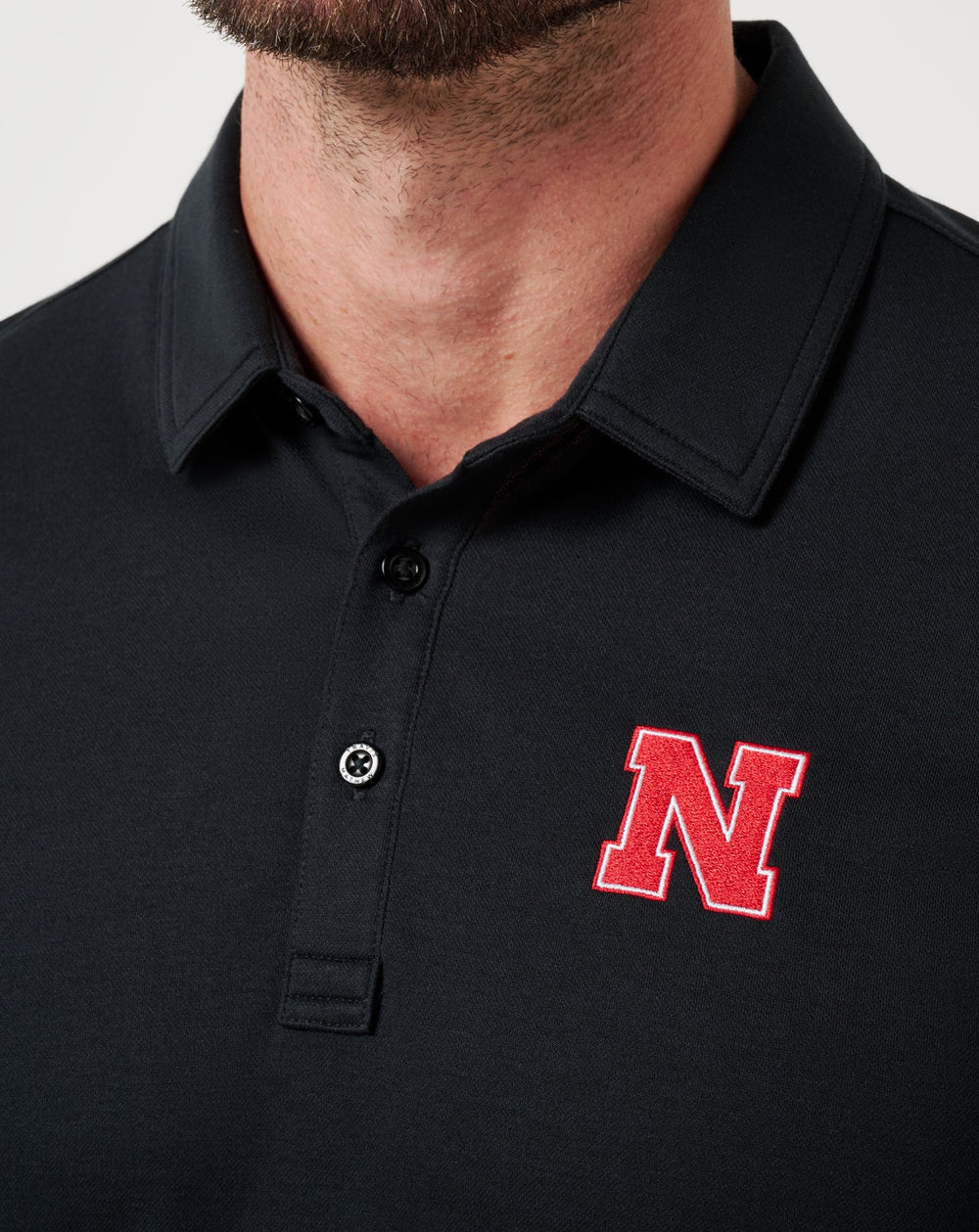 Black Travis Mathew Nebraska School Pride Polo