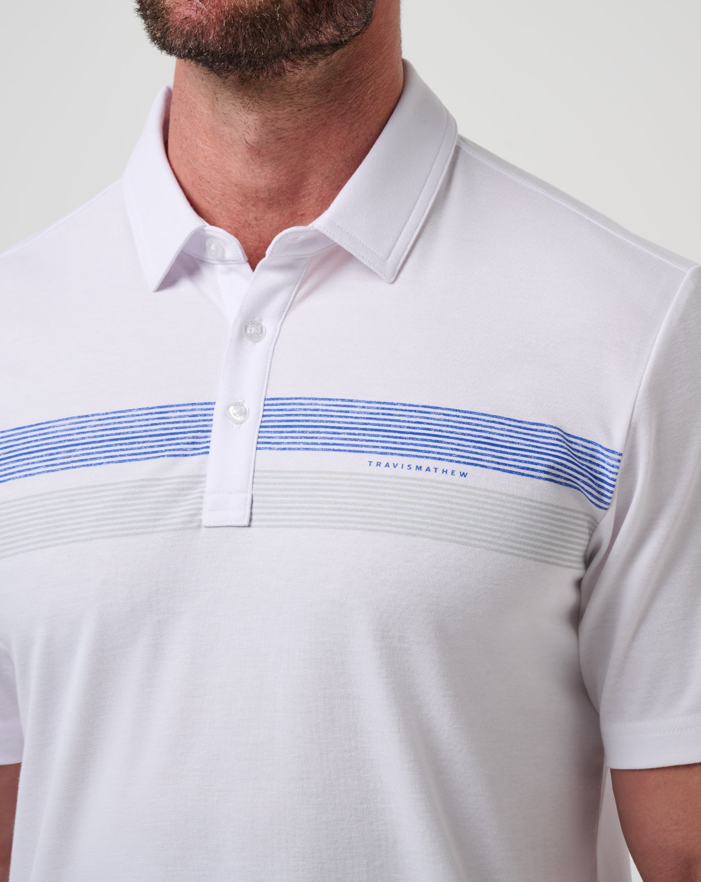 White/Blue Travis Mathew Kansas Top Recruit Polo